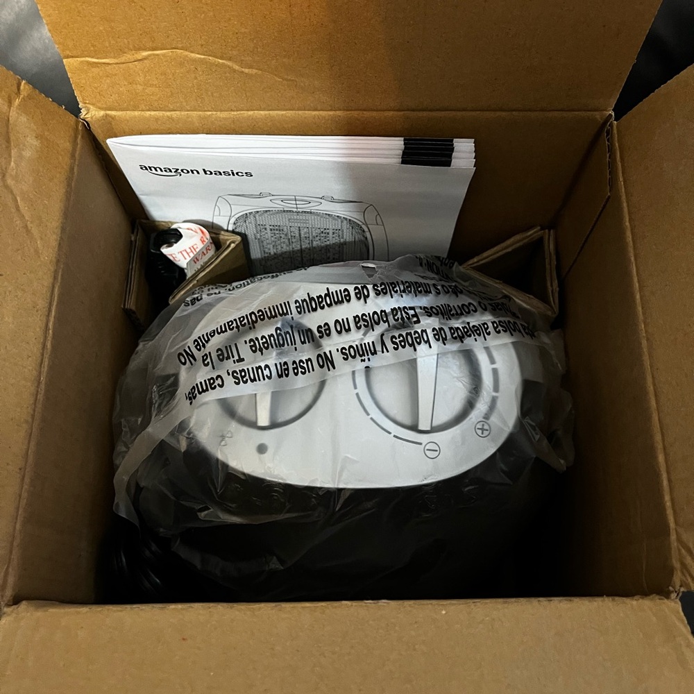 Brand new sealed Amazon basics portable ceramic space heater
